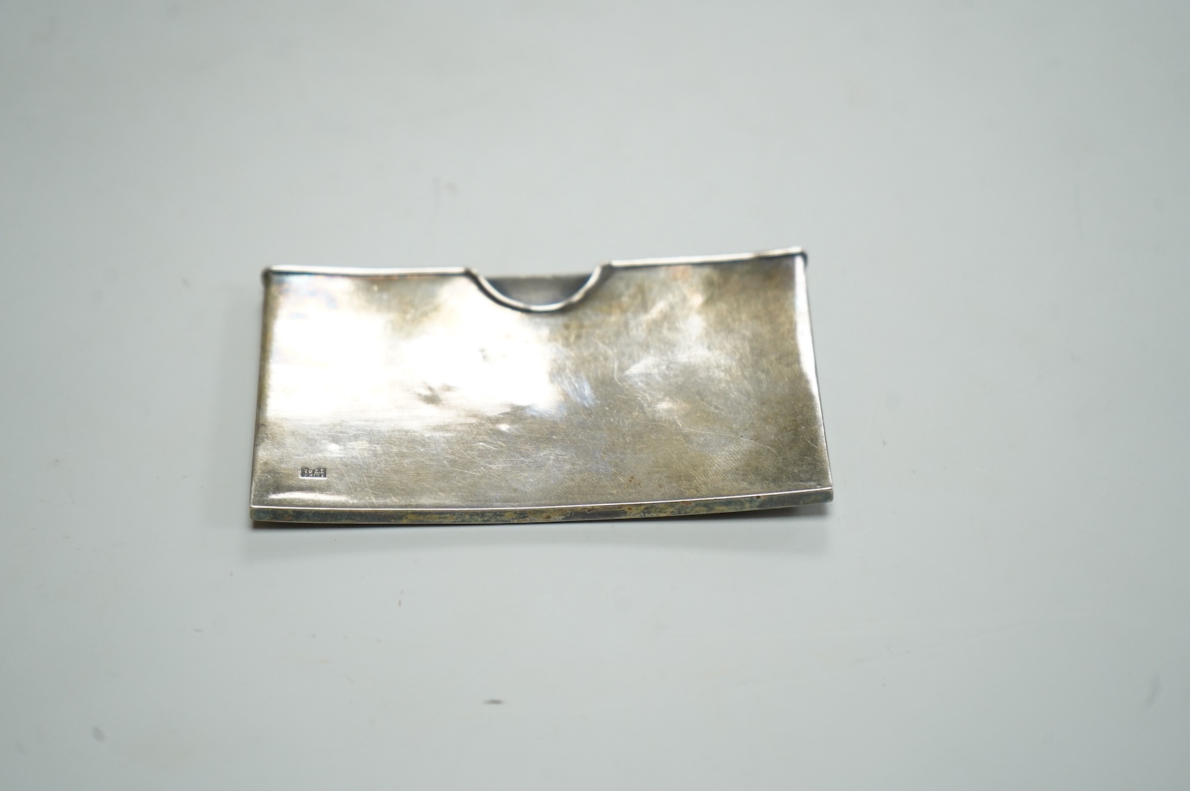 A Japanese Meiji period white metal card case, with applied dragon decoration, jungin mark, 90mm by 55mm.